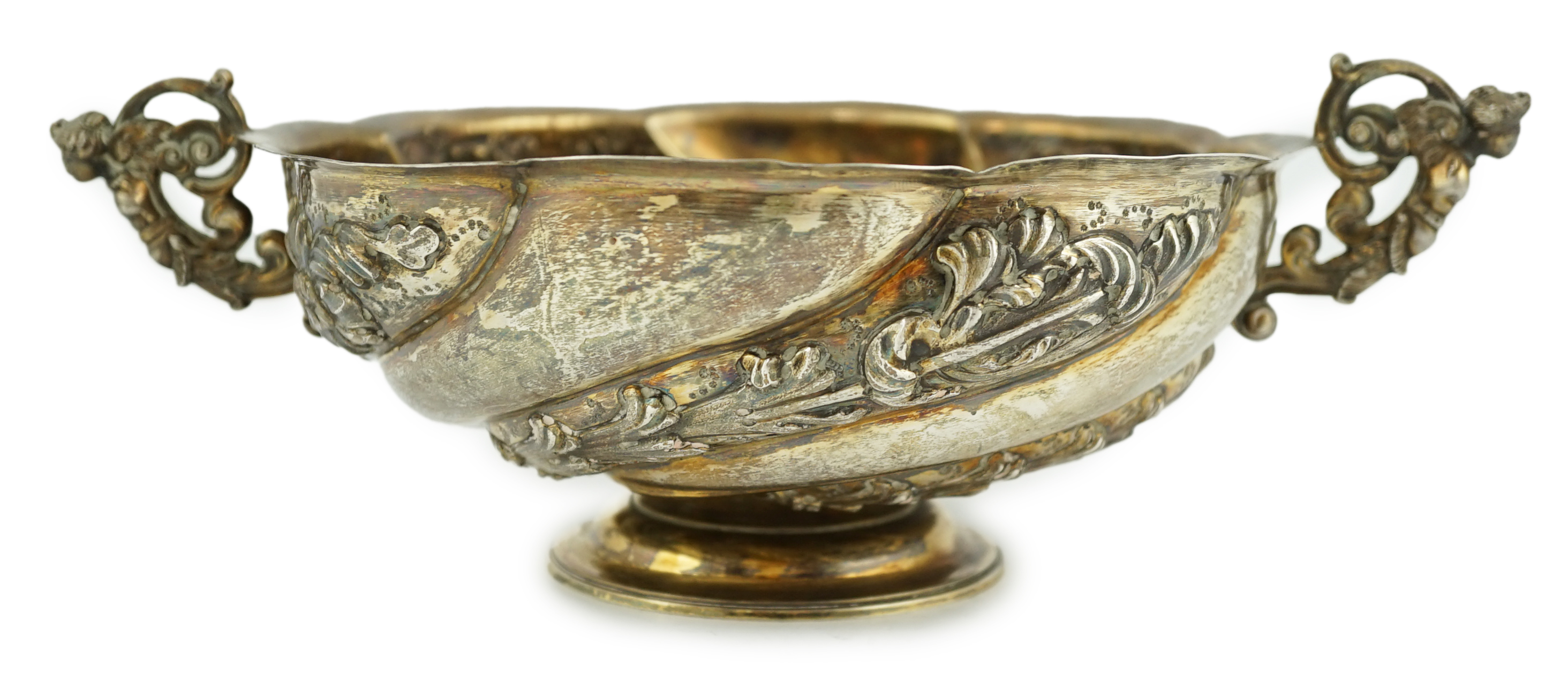 A late Victorian repousse silver two handled fruit bowl, by Charles Stuart Harris